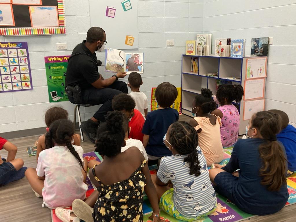 Officer Coleman reading to children
